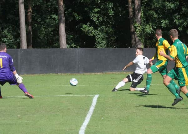 Loxwood's Joe Holvey in action during their FA Cup clash with Holmesdale