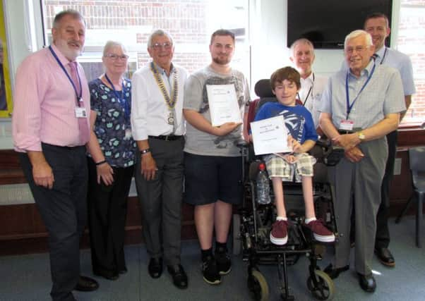 Mark Andrews (head of the Lavinia Norfolk Centre), Sue Virgo (chairman of Rotary Youth Committee), Jeremy Flasket (president of West Worthing Rotary Club), award-winning students Tom Jones and Theo Donnelly, Rotarians Charles Pressley and Tony Moore, and head of Angmering High School Simon Liley.