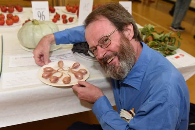 Alan Brooks winner best exhibit in the novice section with his shallots.
Picture: Liz Pearce 
LP170793