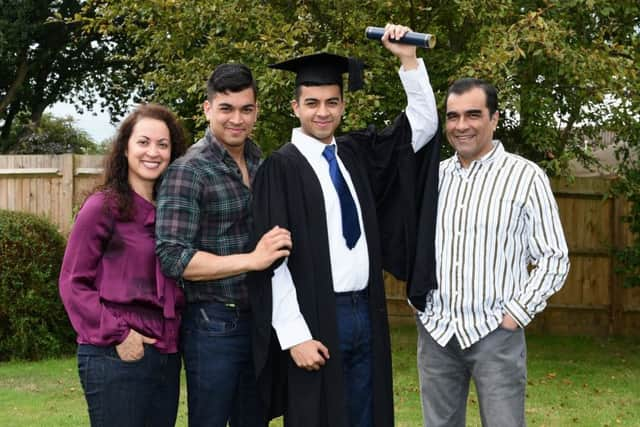 Imran celebrating with his family. Picture: Liz Pearce