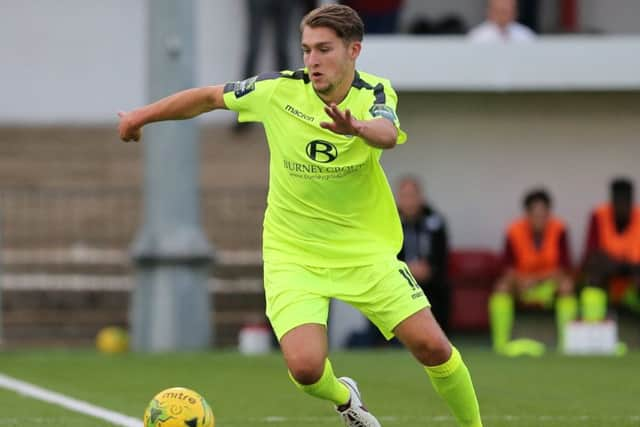 New boy Curtis Gayler on the ball against Carshalton. Picture courtesy Scott White