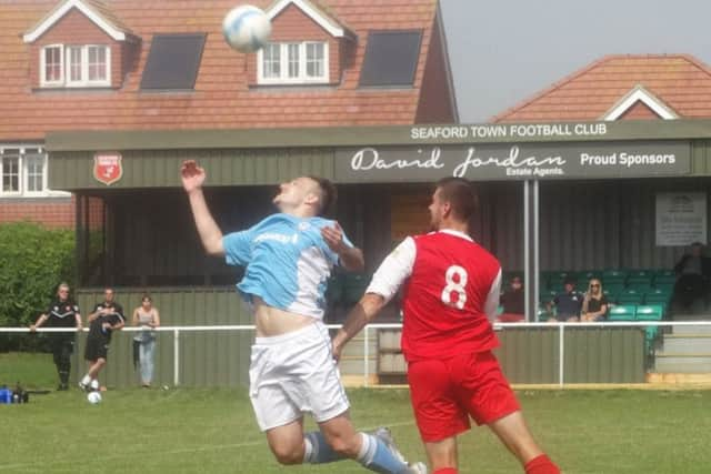 Gordon Cuddington jumps for an aerial ball during Bexhill United's 3-1 win away to Seaford Town on Monday. Picture courtesy Mark Killy