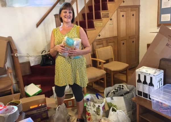 Volunteers sorting through the many donations at Itchenor Church