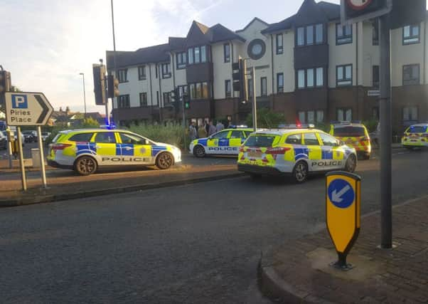 Police outside the flats in Horsham