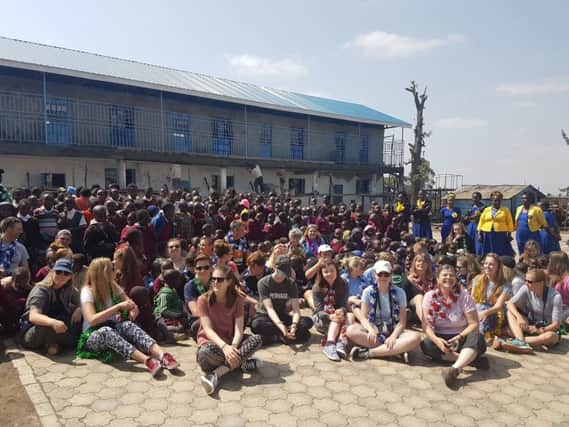 Volunteers from Chichester College celebrate the completion of the Walk Centre Primary School