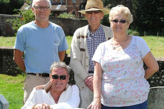 The family with the homeless man. Picture: Steve Robards