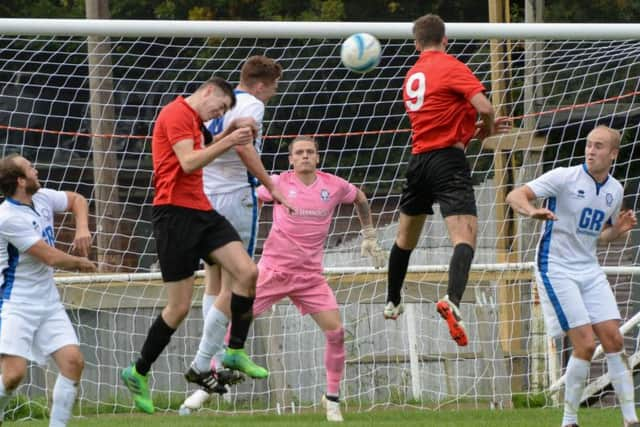 Action from AFC Uckfield v Hassocks. Picture by PW Sporting Photography