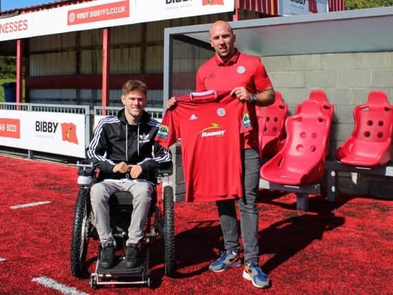 Worthing chairman George Dowell with Adam Hinshelwood.