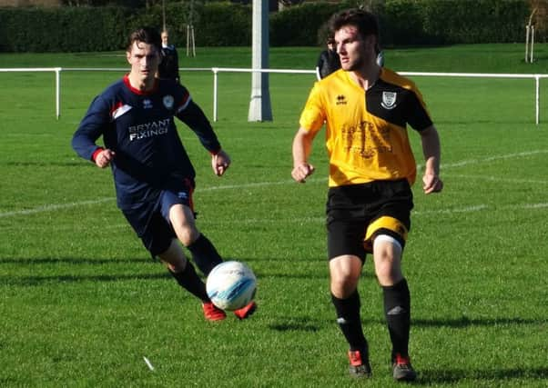 Bexhill United v Billingshurst football action - Connor Robertson and Freddie Bowls SUS-171015-135024002