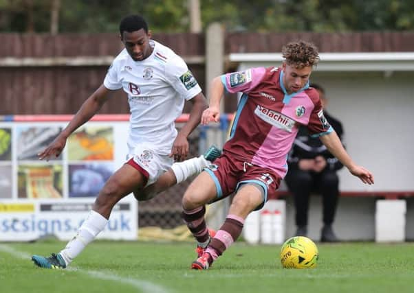 Hastings United full-back John Akoto keeps a close eye on a Corinthian-Casuals opponent during Saturday's 3-2 defeat. Picture courtesy Scott White