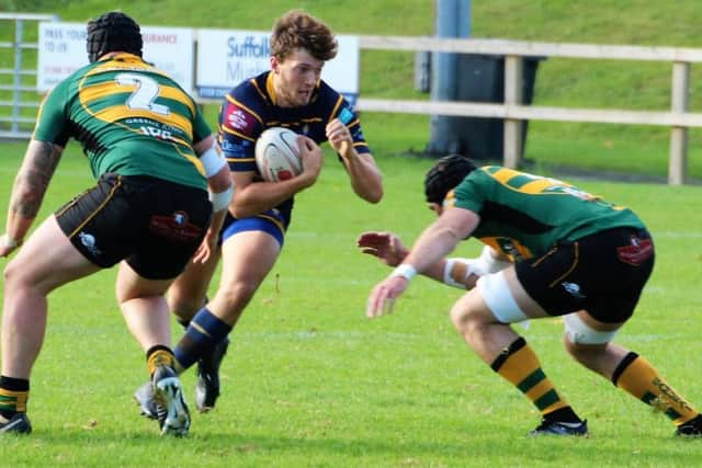 Kieran Leeming is tackled during Saturday's clash at Bury St Edmunds. Picture by Colin Coulson