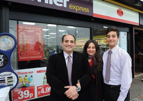 David, Randa and Maximus Isaac at Maxi's Convenience Store and Post Office