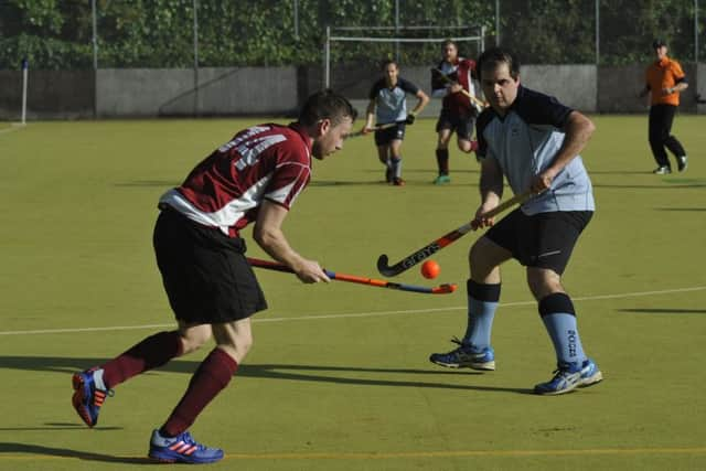 Jon Meredith stands in the way of a Crawley opponent.