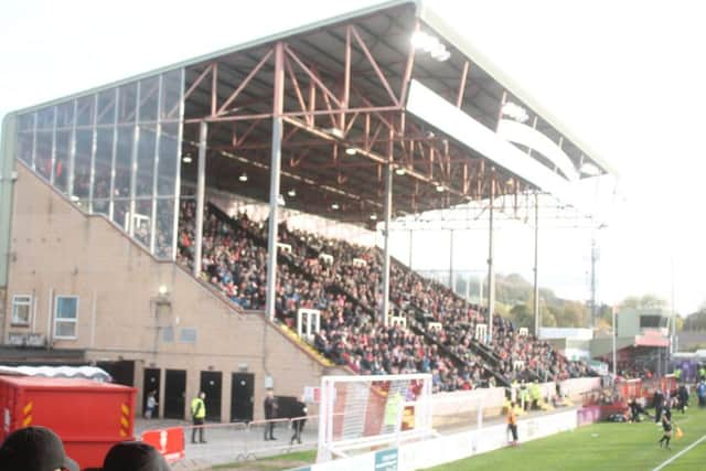 The small but Packed St Andrew's Stand. Another decent crowd for Lincoln City FC SUS-171031-093320002