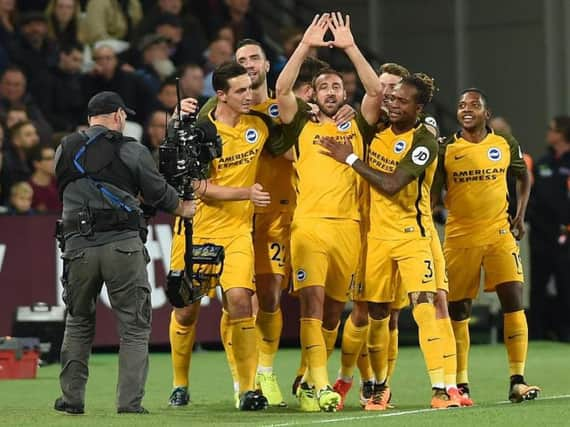 Albion players celebrate the first goal in their 3-0 win at West Ham. Picture by Phil Westlake (PW Sporting Photography)