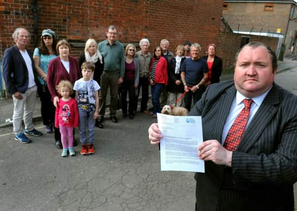 Crawley East Park/Matlhouse Road Crawley residents angry about poor lighting on footpath - pictured here with Michael Jones, Labour county councillor earlier this year