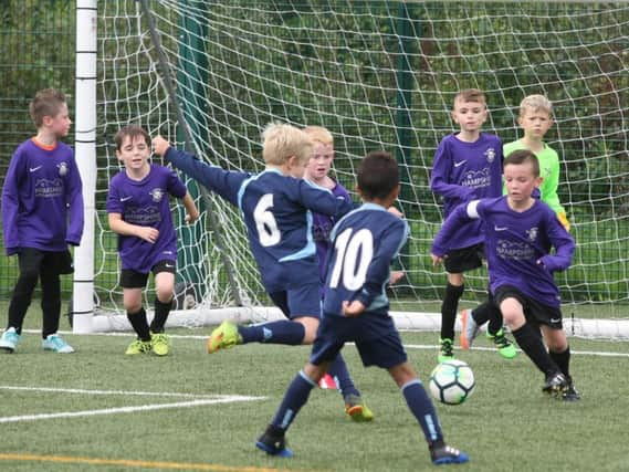 Youth football action.