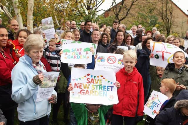 DM17110843a.jpg Residents protest over plans to build an access road through New Street Gardens, Horsham. Photo by Derek Martin Photography. SUS-171211-133047008