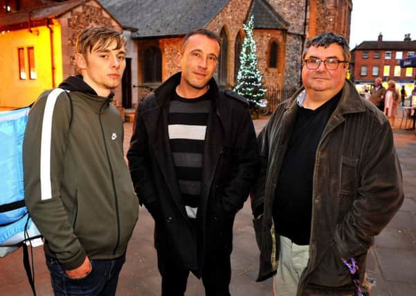 Jack Jones, Tom Moore and canon Mark Payne outside St Pancras Church in Chichester. Picture by Steve Robards SR1729525