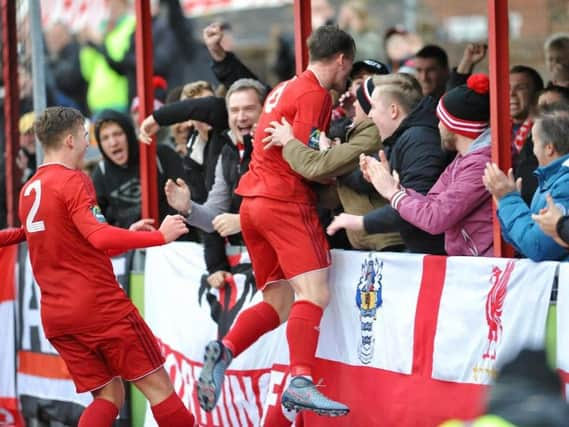 Reece Hallard celebrates after firing Worthing ahead on Saturday. Picture by Stephen Goodger