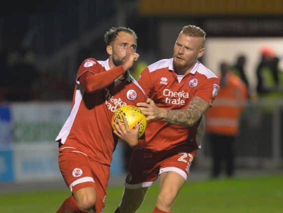 Thomas Verheydt celebrates with Josh Payne, who scored Crawley Town's first against Exeter. Picture by Jon Rigby